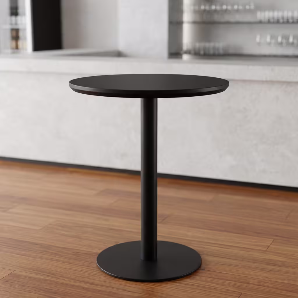 Modern Round Height Dining Table Premium Modern Round Height Dining Table in a minimalist matte black finish, showcasing a circular top panel supported by a central metal pedestal pillar column and a heavy-duty floor-flush circular disc base, standing flat on smooth grey concrete studio flooring against an off-white background wall.