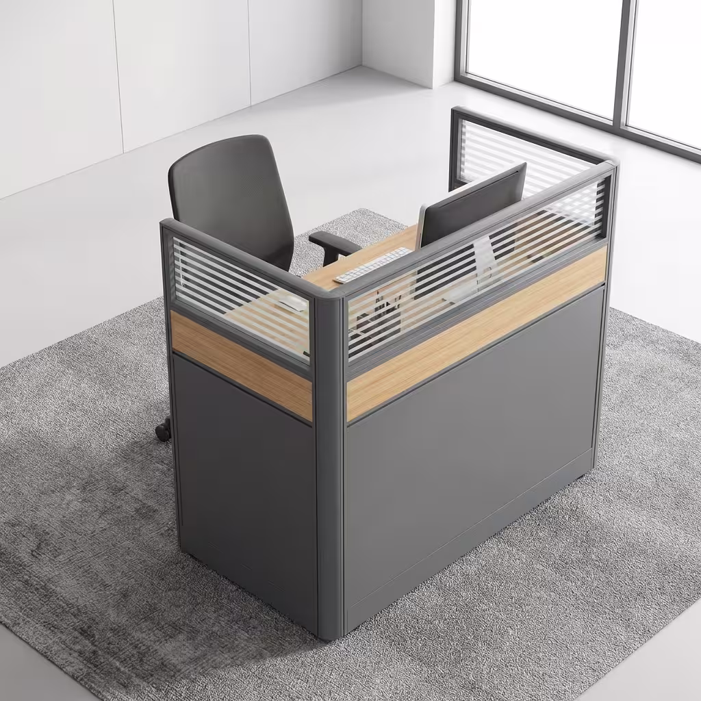 Premium 1.2M Single Modular Office Workstation featuring a solo desk layout with a light oak woodgrain desktop, wrapped on three sides by integrated matte grey privacy partition screens with a central woodgrain accent stripe and translucent horizontal-slatted glass toppers, paired with an ergonomic black office chair on a textured grey area rug inside a modern sunlit corporate office.