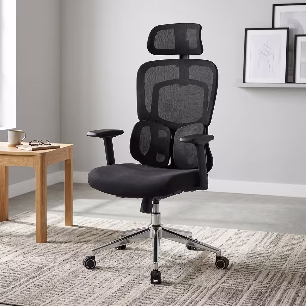 Premium High-Back Orthopedic Mesh Executive Office Chair featuring an open-airflow black mesh backrest, matching adjustable headrest, flat black T-shaped armrests, a unique dual-wing lower-back support layout, a plush black seat cushion, and a highly reflective polished chrome five-star star base with rolling wheels, standing on a textured light cream area rug.