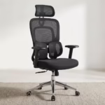 Premium High-Back Orthopedic Mesh Executive Office Chair featuring an open-airflow black mesh backrest, matching adjustable headrest, flat black T-shaped armrests, a unique dual-wing lower-back support layout, a plush black seat cushion, and a highly reflective polished chrome five-star star base with rolling wheels, standing on a textured light cream area rug.