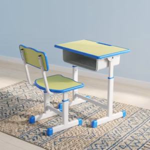 Premium Kid's Study Desk & Chair Set in a vibrant lime-green and bright blue finish, showcasing a rectangular study desk with an integrated open storage shelf, a matching mid-back school chair, and white adjustable steel leg frames fitted with blue floor-stabilizing glider caps, resting on a blue and white patterned area rug.