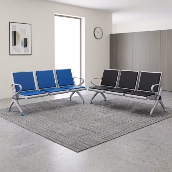 Premium 3-Seater Padded Metallic Waiting Bench featuring three linked silver metallic chairs with black padded leatherette seats and backrests, integrated curved aluminum-alloy side armrests, and sturdy silver metal triangle legs with adjustable leveling glides, standing on a reflective white floor inside a modern corporate reception room.