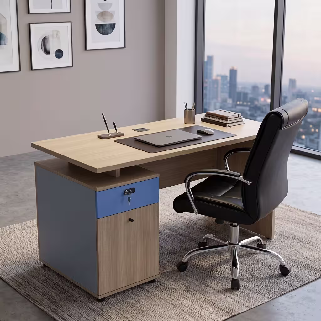 Premium 1.2M Wooden Office Desk With Storage in a light oak woodgrain finish, featuring an integrated slate-blue side return storage console with a key lock, a built-in dark brown leather desk blotter mat supporting a closed dark laptop and mouse, paired with a high-back black leather swivel rolling chair on a textured carpet.