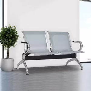Premium 2-Link Steel Office Waiting Bench featuring two linked silver metallic chairs with perforated mesh patterns, integrated curved polished chrome side armrests, and sturdy silver metal arching legs with adjustable leveling glides, standing on a textured tan woven rug inside a modern corporate reception room.