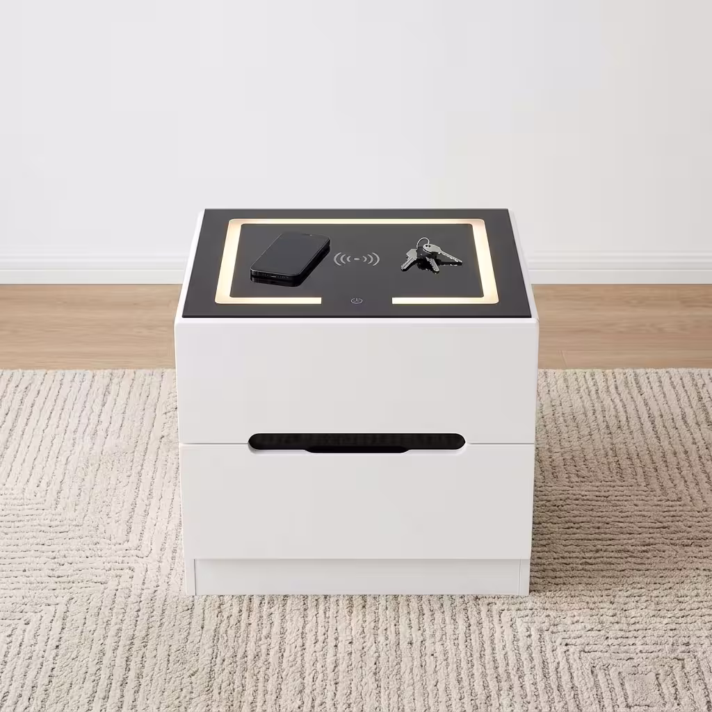 Modern white Bedside Table With Lighting featuring an integrated wireless charging top panel, warm LED border glow, and a minimalist handle less drawer design on a beige rug.