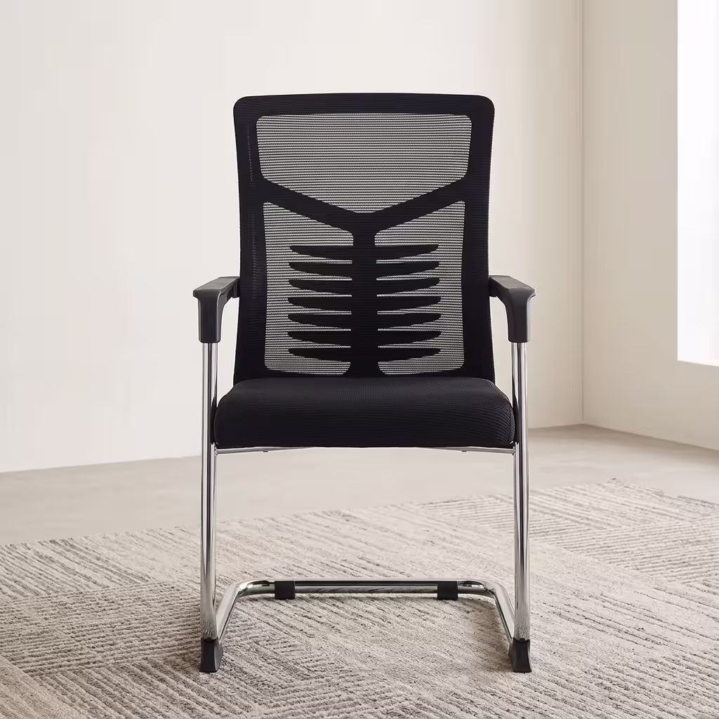 Medium Back Office Visitor Chair featuring a black breathable mesh backrest, contoured spinal support, and a polished chrome cantilever sled base on a textured cream rug.