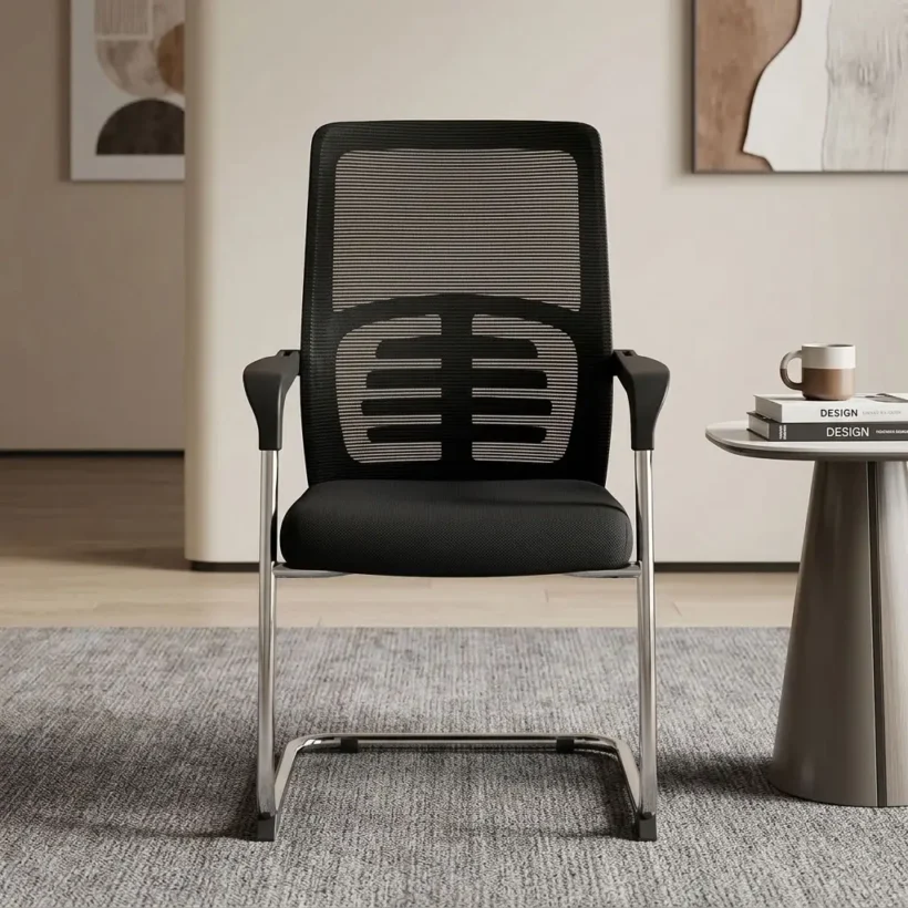 A medium-back office visitor chair featuring a black mesh backrest with a prominent horizontal ribbed lumbar support pattern. The chair has a thick, contoured black fabric seat cushion, black polymer loop armrests with chrome-accented support bars, and a heavy-duty continuous loop cantilever base made of polished chrome steel.