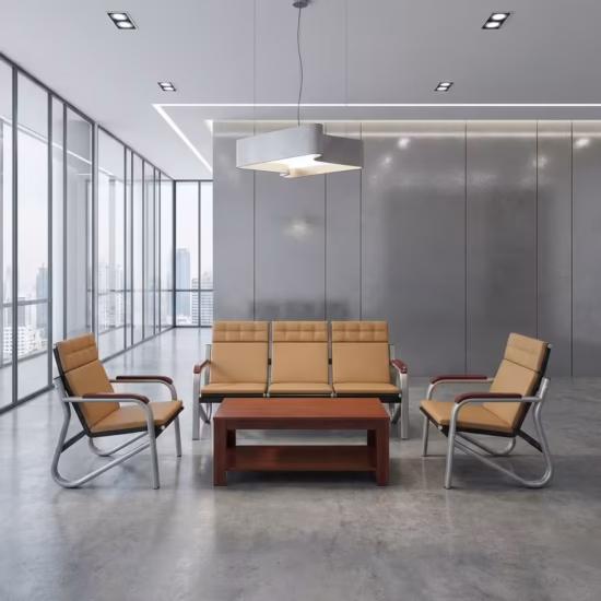 Premium Executive 5-Seater Reception Sofa Set featuring a 3-seater tandem sofa and two single-seater armchairs upholstered in tan segmented leatherette with chrome cantilever frames and dark wood armrests, arranged around a matching rectangular wooden two-tier coffee table on a polished concrete floor inside a modern corporate office lobby.