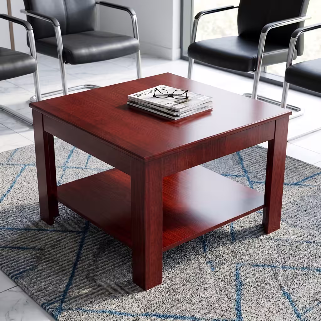 0.6m Square Wooden Office Coffee Table with a built-in lower shelf in a warm mahogany finish, placed on a patterned rug next to an office sofa.