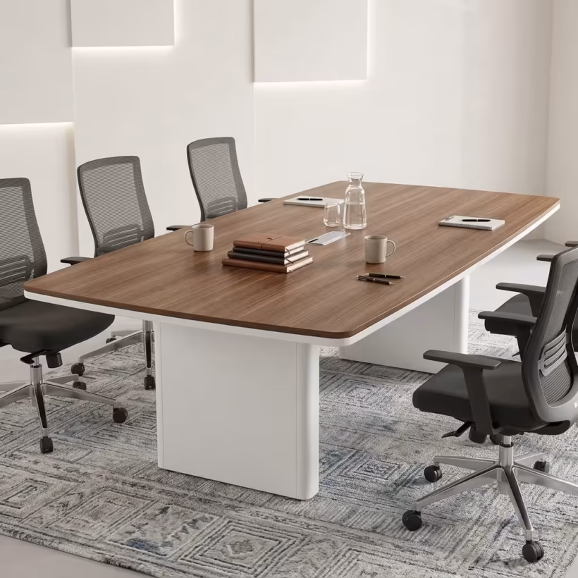 2.4m Executive Office Boardroom Table featuring a warm walnut wood top, modern white curved pedestal legs, and clean white edge banding, paired with mesh office chairs.