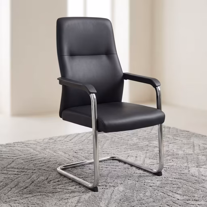 Executive Leather visitor chair in black color featuring a chrome cantilever base and padded armrests, displayed on a textured grey rug.